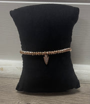 Rose gold stretch bracelet with charm